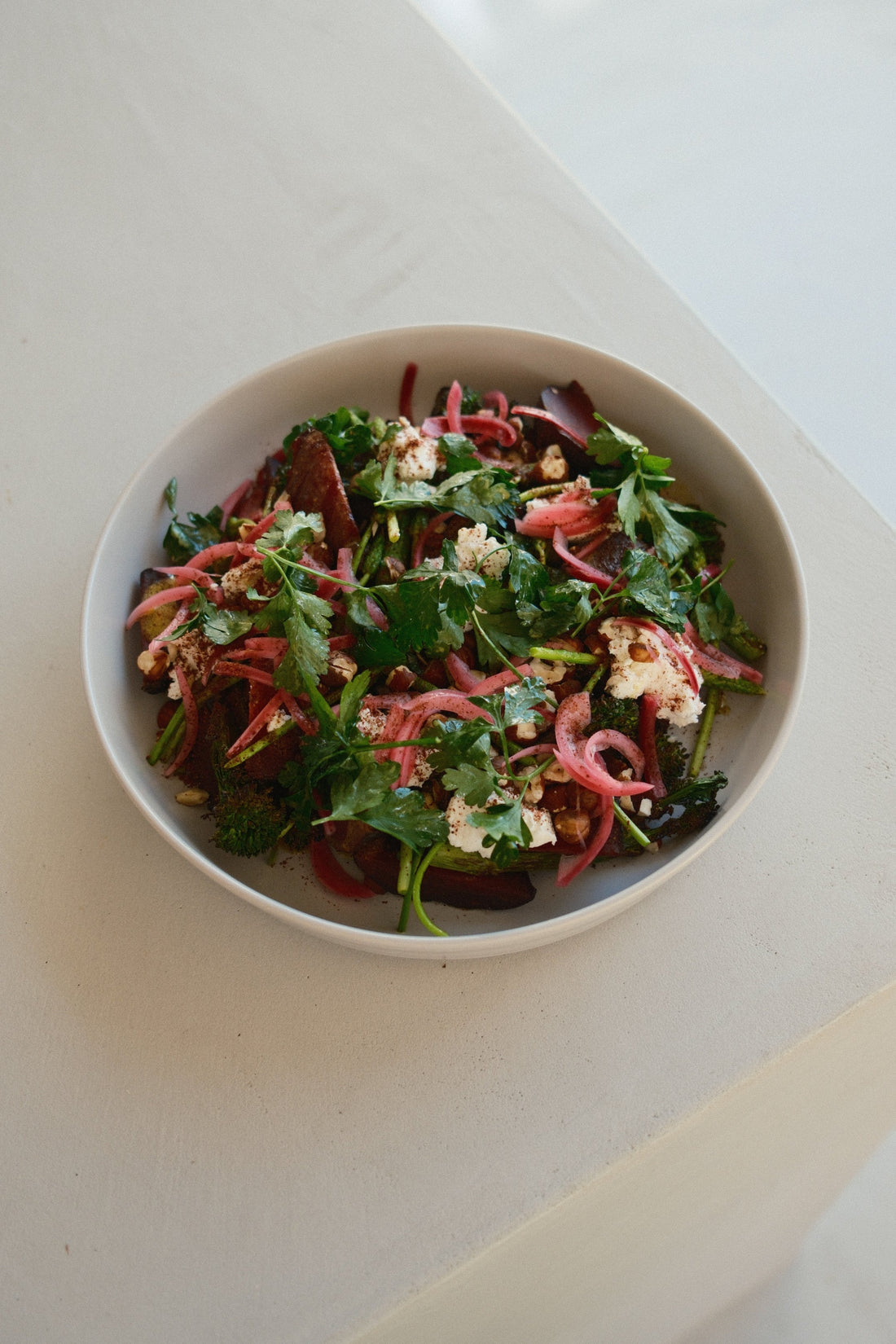 Roasted beetroot wedges with grilled bimi, soft white cheese and toasted hazelnuts