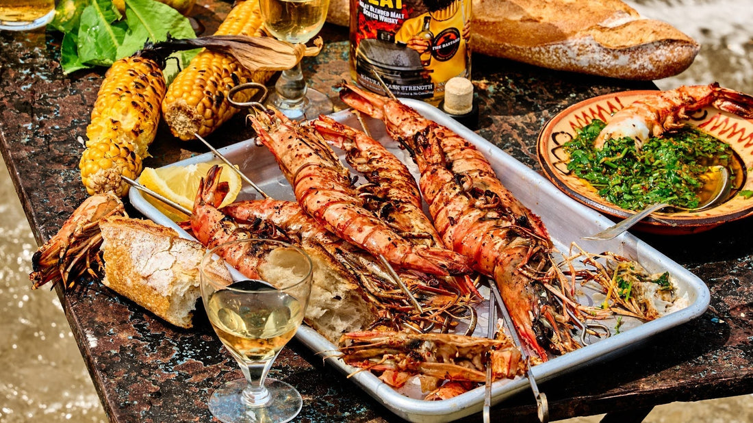 Whole prawn skewers charring over direct heat on a Bastard kamado