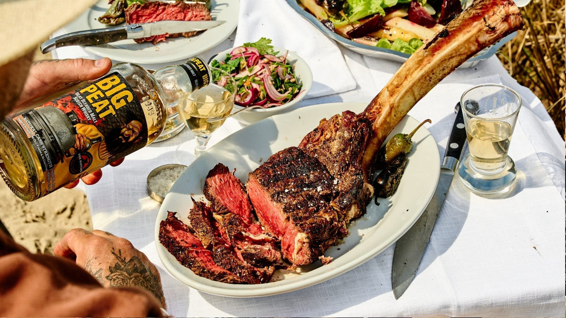 Seared tomahawk steak resting on a board with charred jalapeño relish alongside